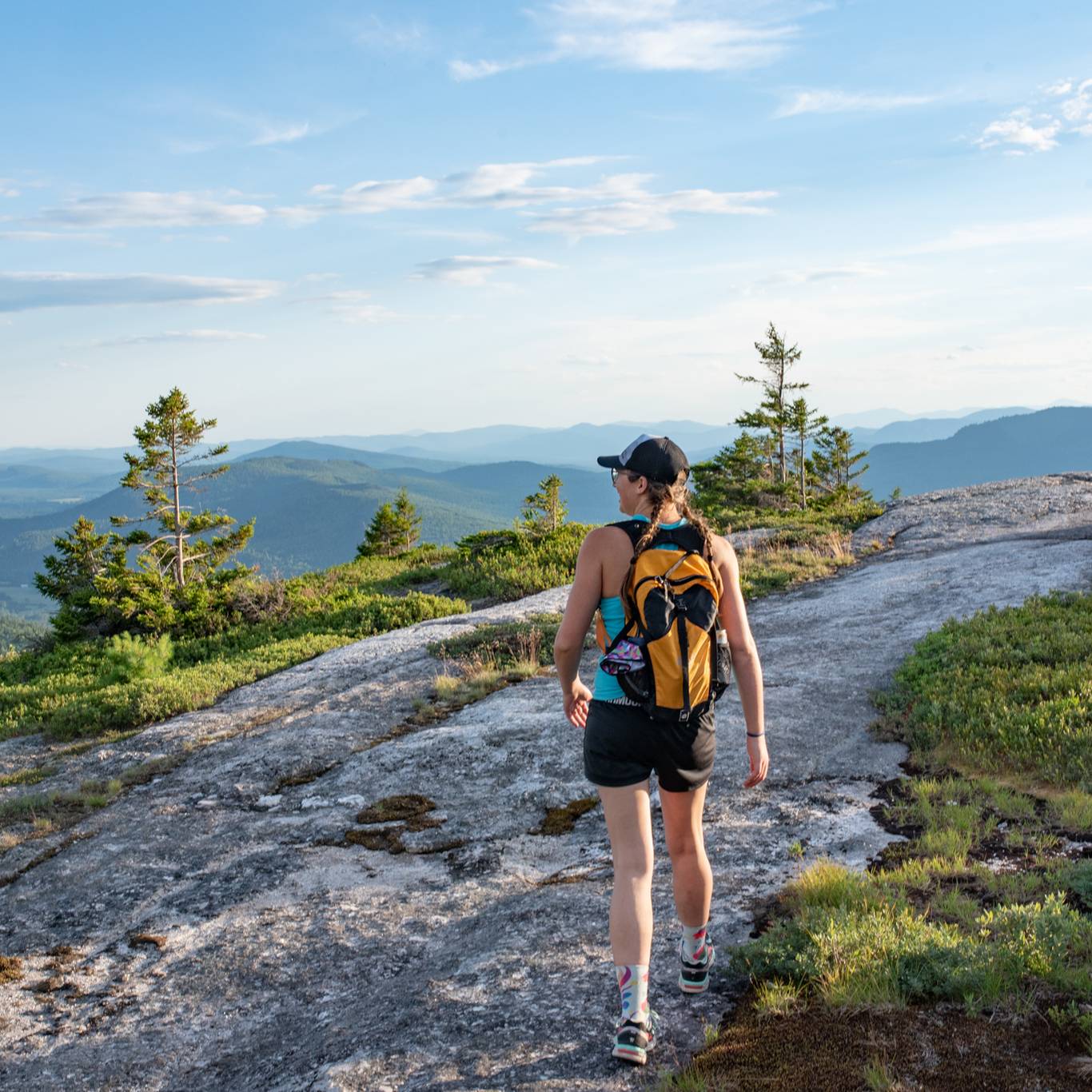 A woman hiking at Sunday River Resort in the summer.