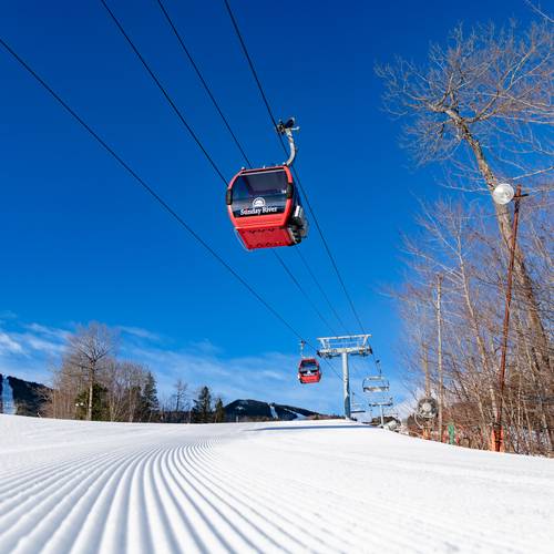 The Chondola at Sunday River on a blue sky day
