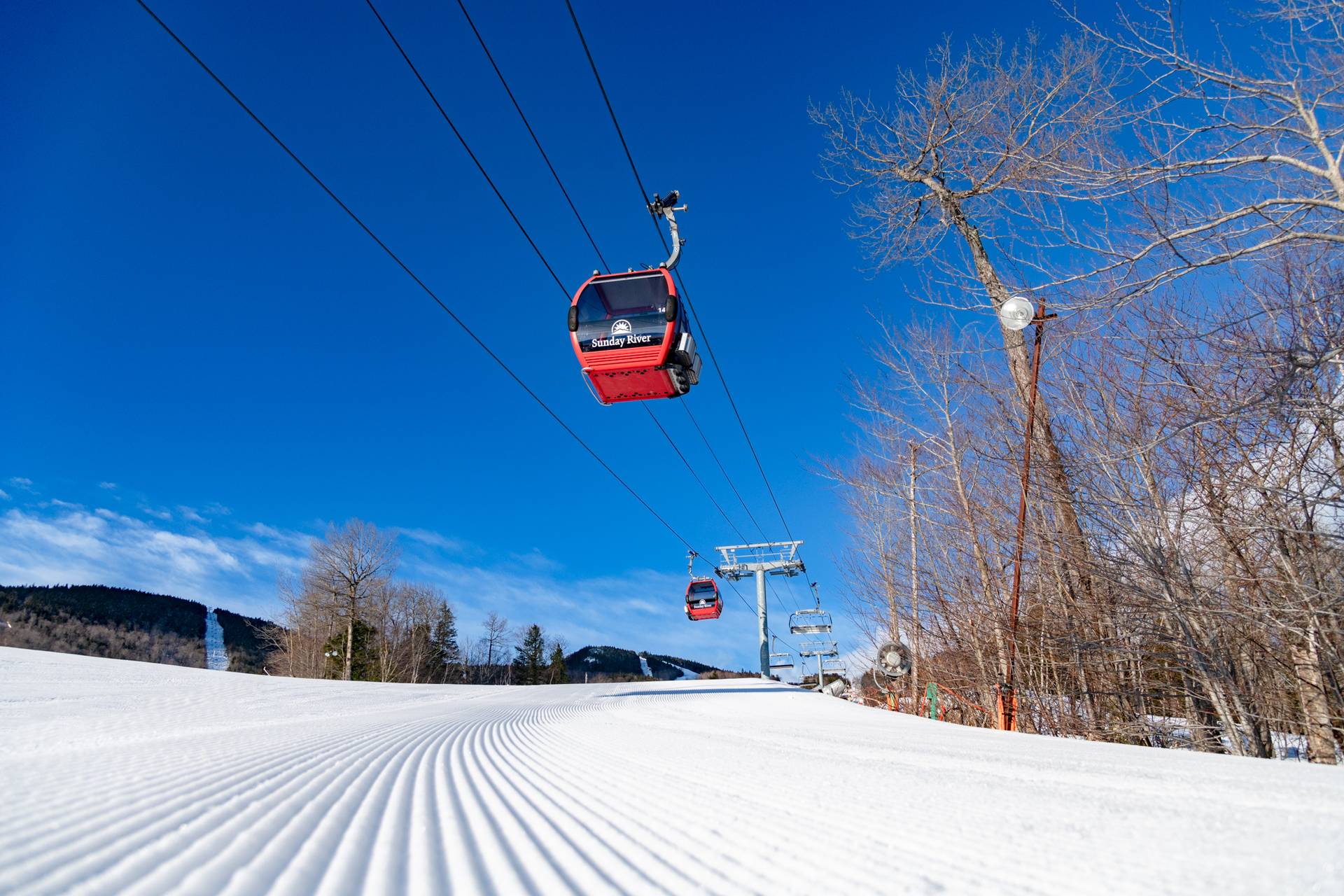 The Chondola over fresh corduroy on a bluebird day.
