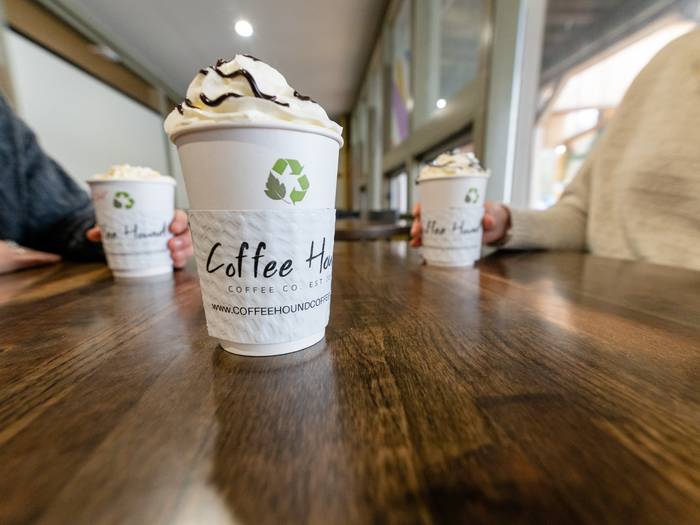 Two women enjoying coffee at Coffee Hound.