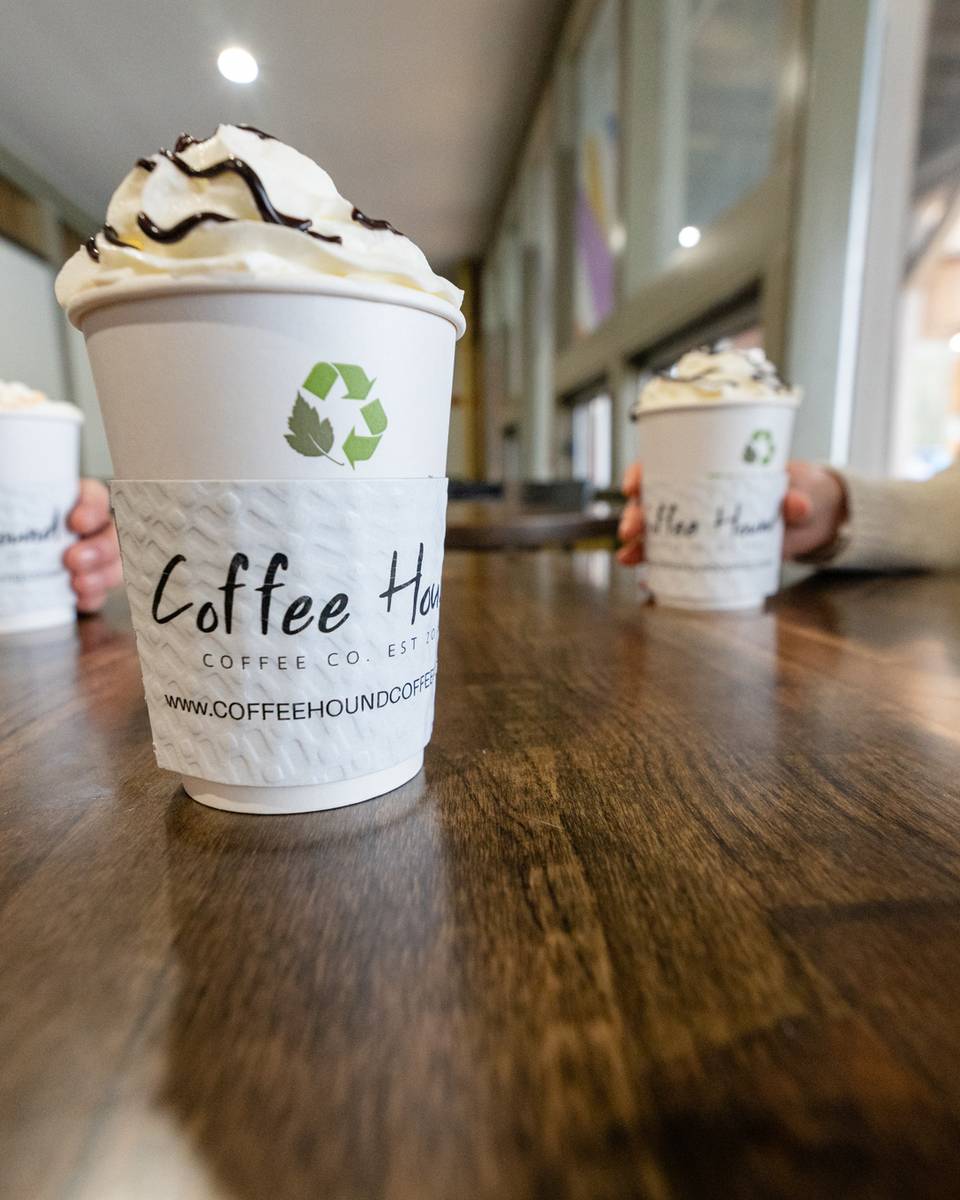 Two women enjoying coffee at Coffee Hound.