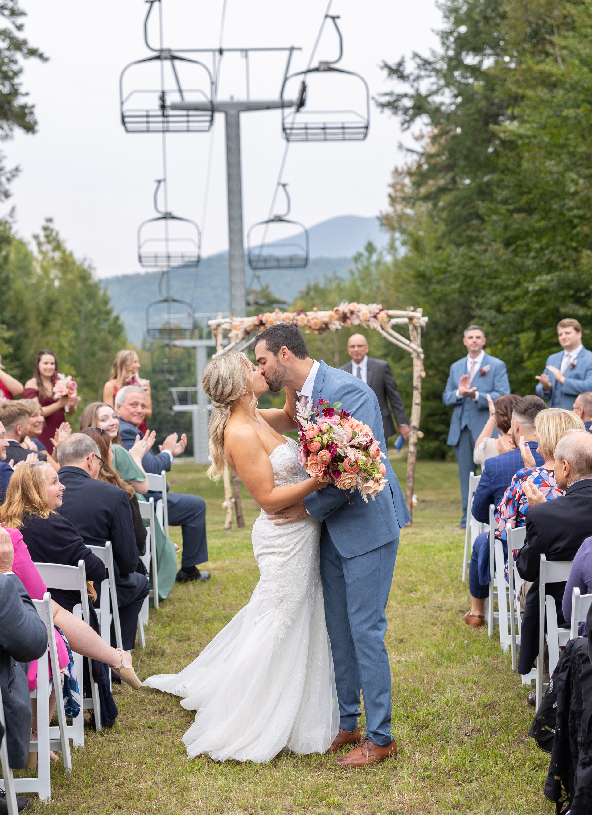 A couple embrace after wedding ceremony