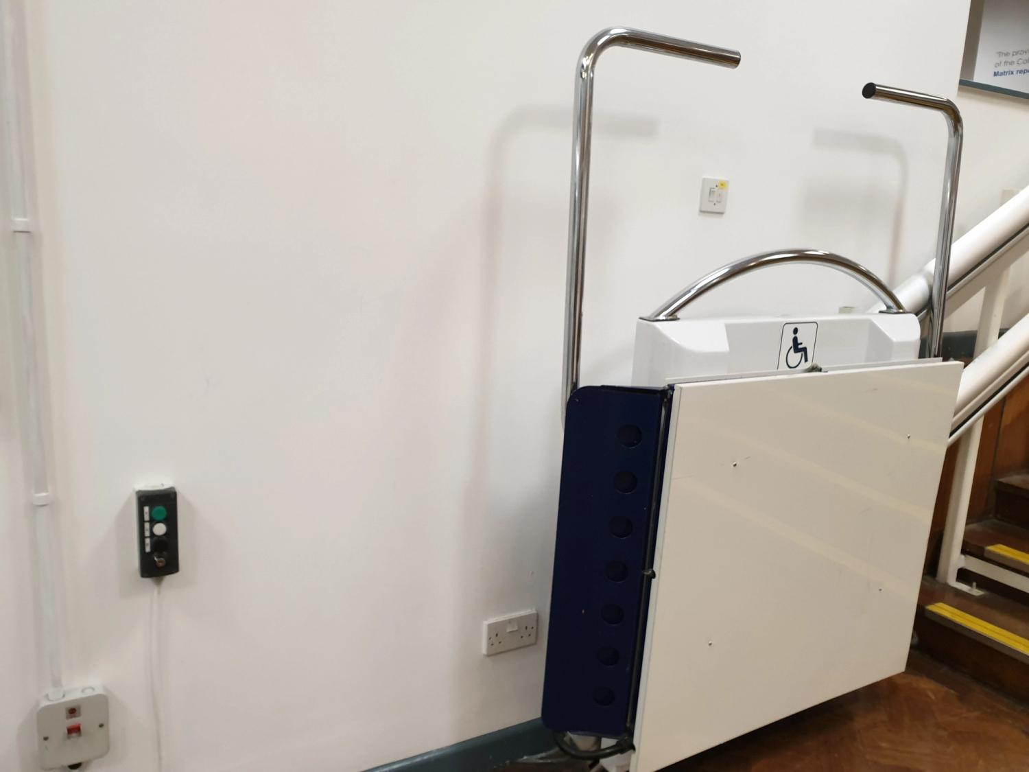 As you can see, this is the lift folded, and the button to activate it on the left!