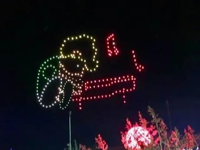 A nighttime light display shows a gingerbread figure holding a gift.