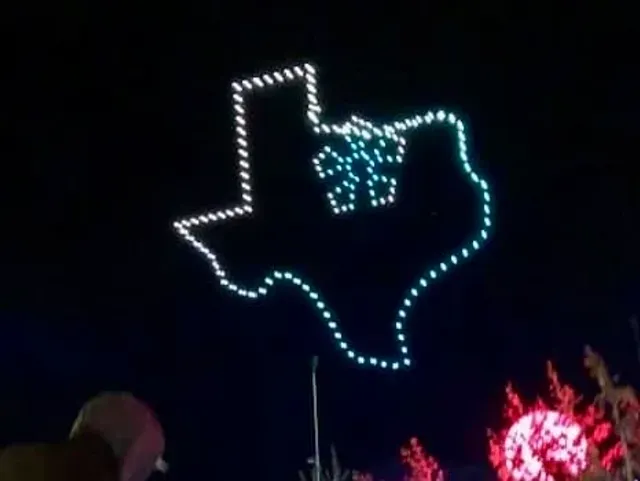 A nighttime light display outlines Texas with a longhorn symbol inside.