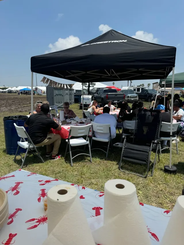People enjoying the crawfish by the Data Projections Team