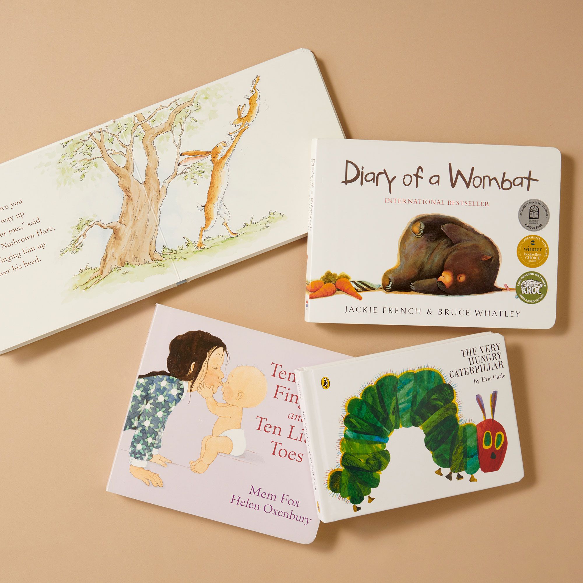 Flatlay of classic children's books including The Very Hungry Caterpillar and Diary of a Wombat
