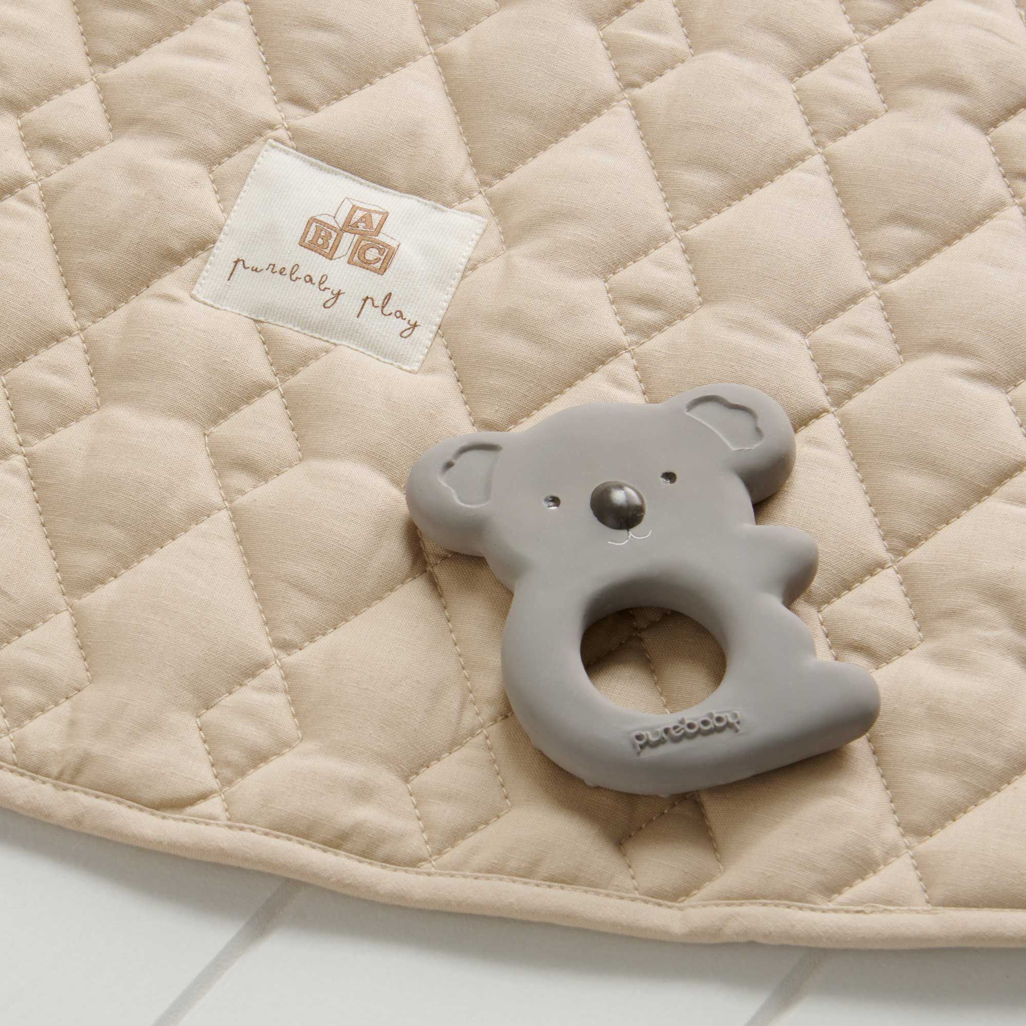 Flat lay of Purebaby’s koala natural rubber teether