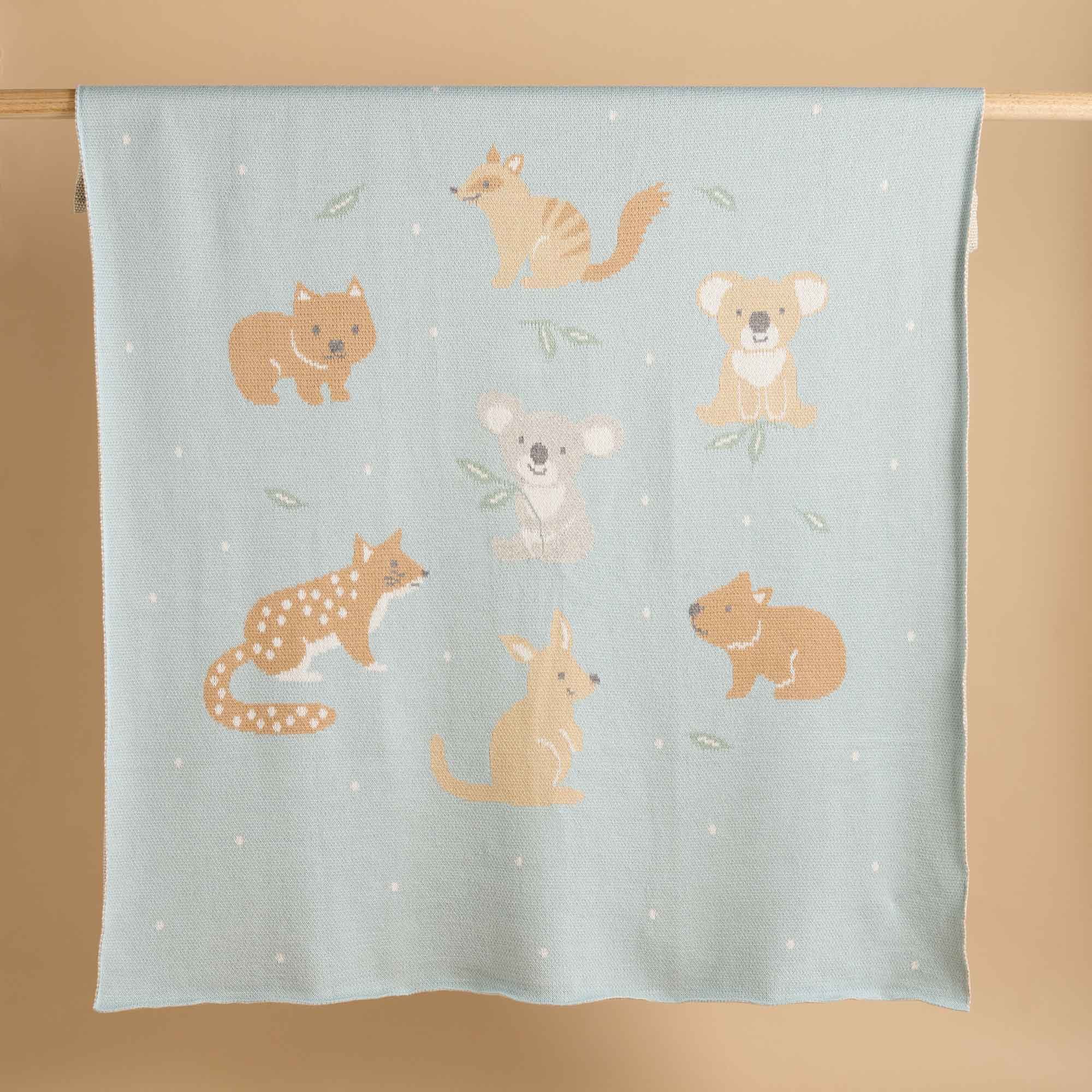 Green Purebaby blanket with Australian animal motifs