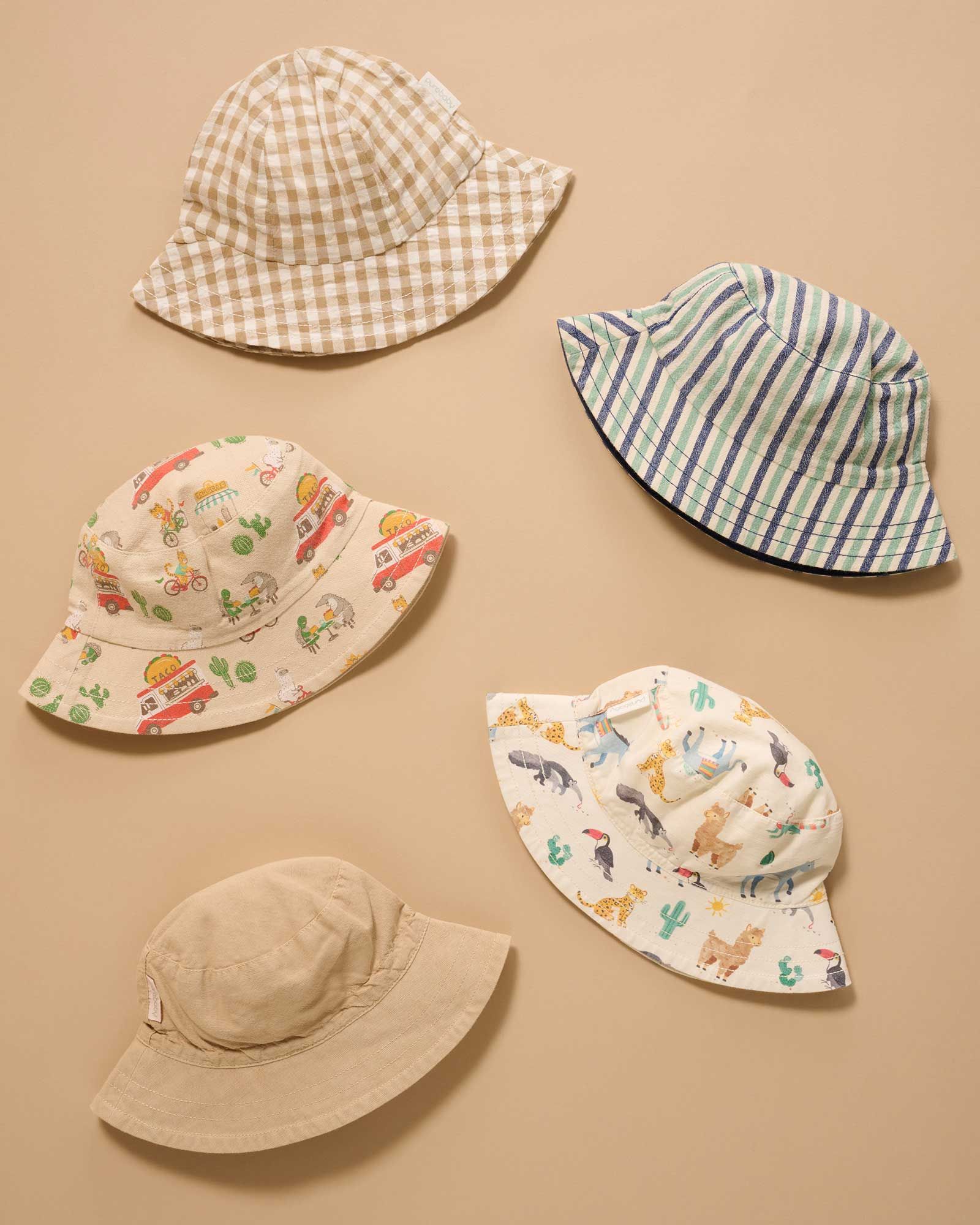 Flat lay of kids wide brim sun hats