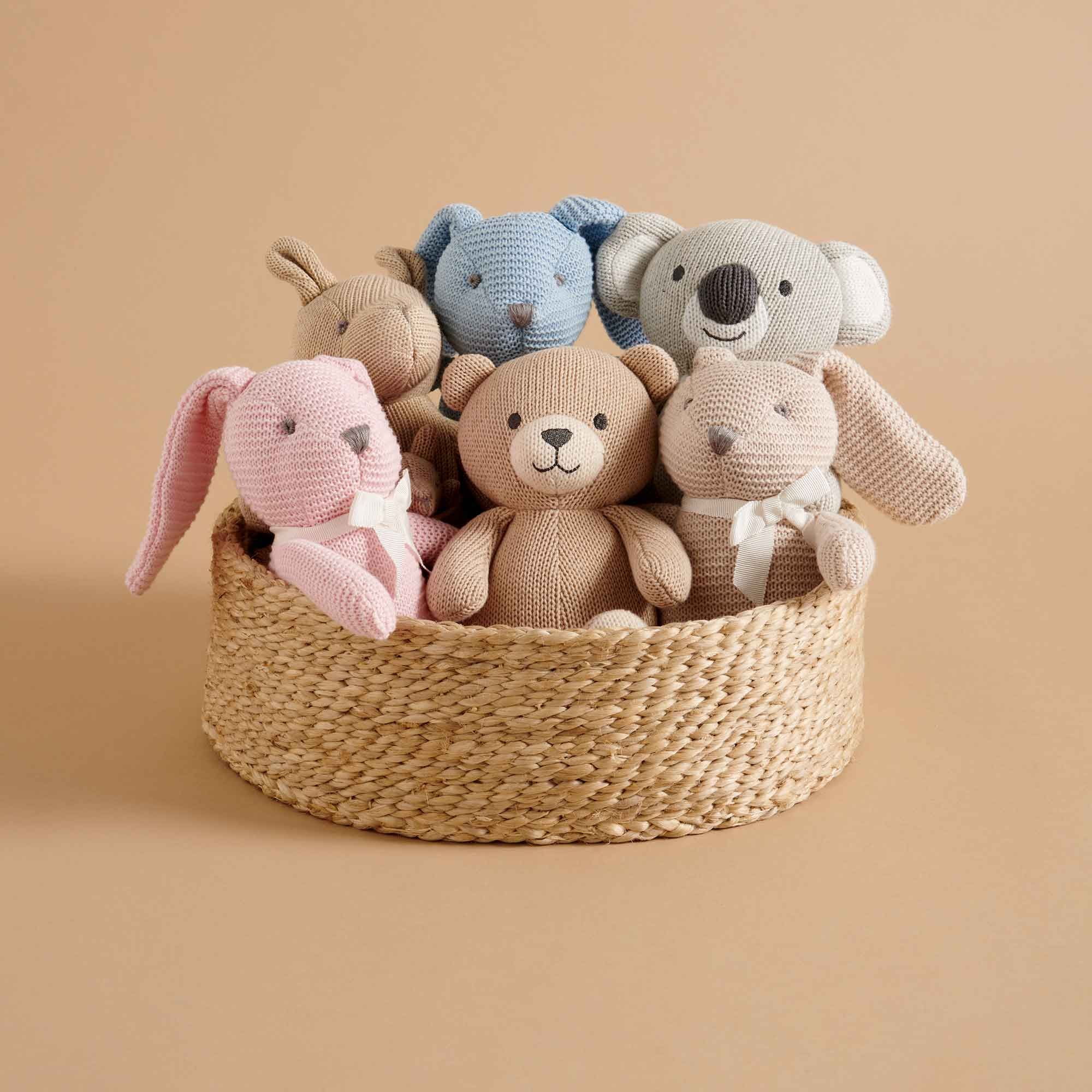 basket of soft knitted toys
