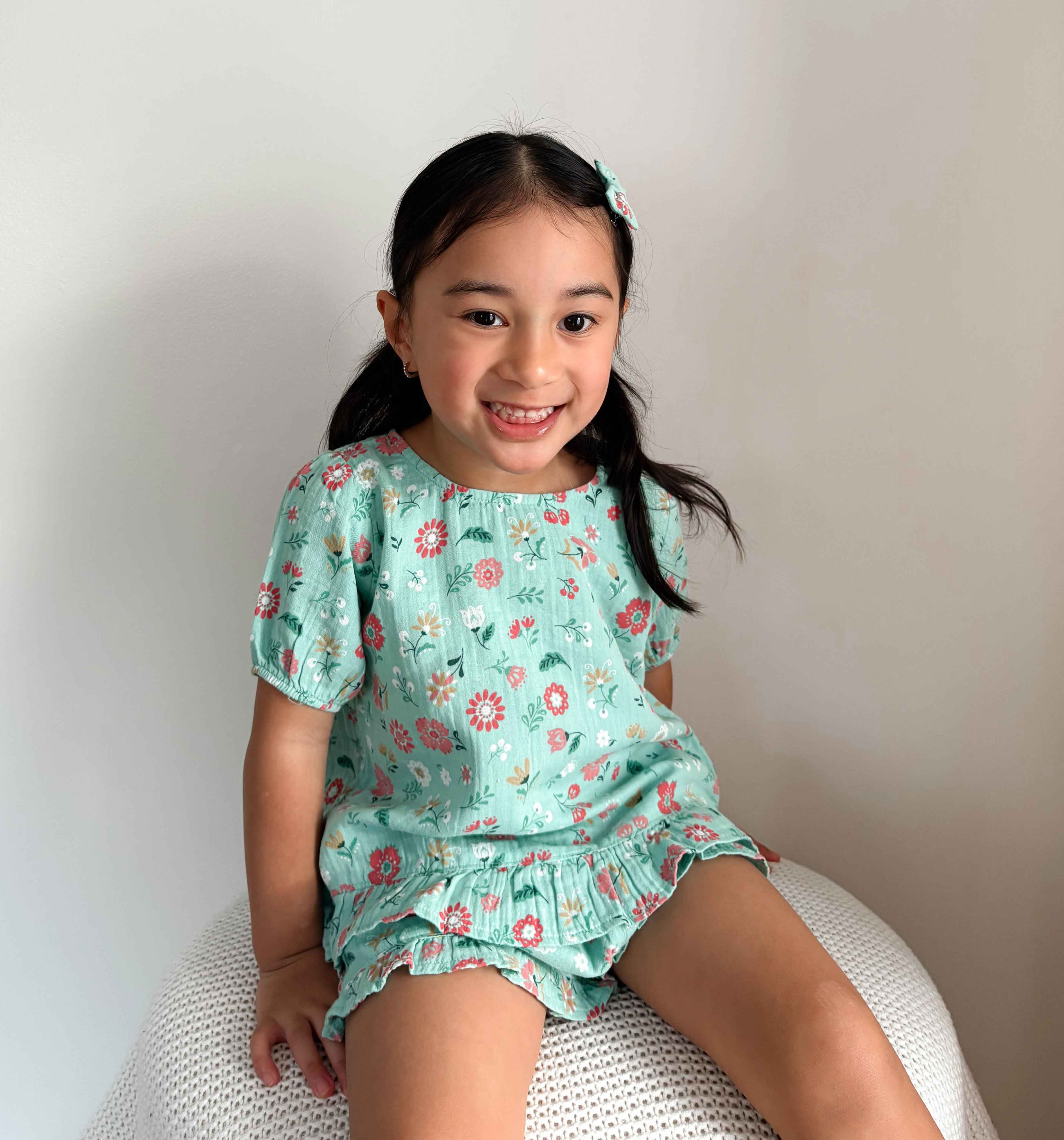 Toddler girl in a matching floral summer set