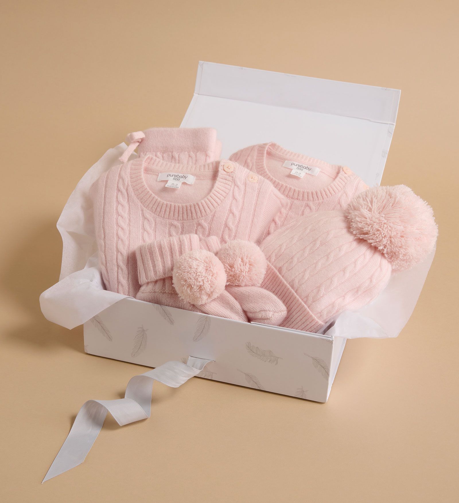 Gift box featuring cashmere styles folded up inside it