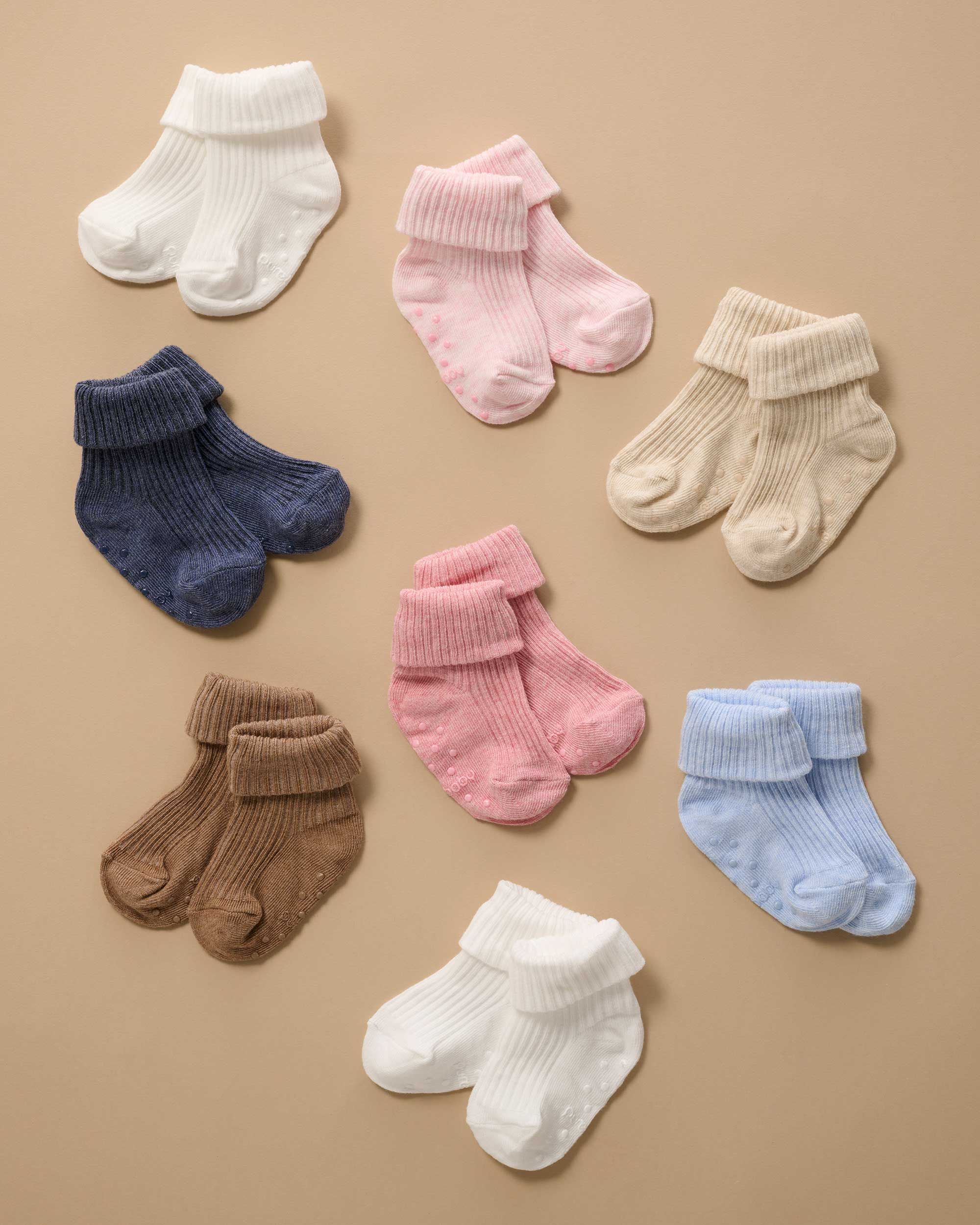 Purebaby Ribbed Organic Baby Socks laid out by colour