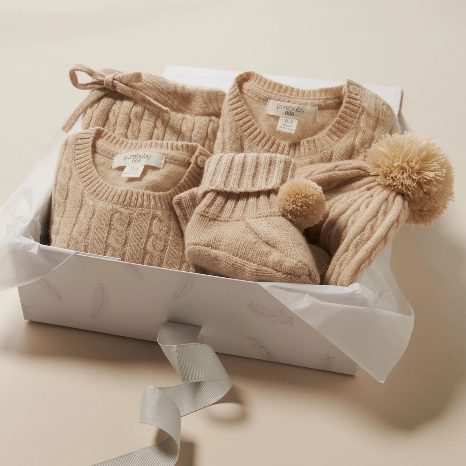 Gift box featuring cashmere styles folded up inside it