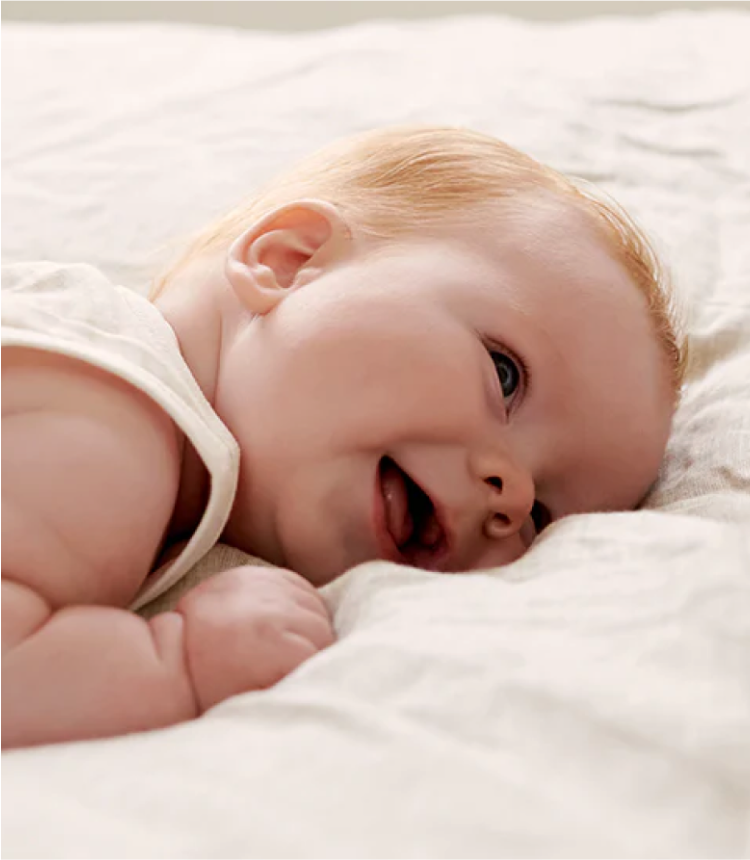 Baby wearing a Purebaby singlet 