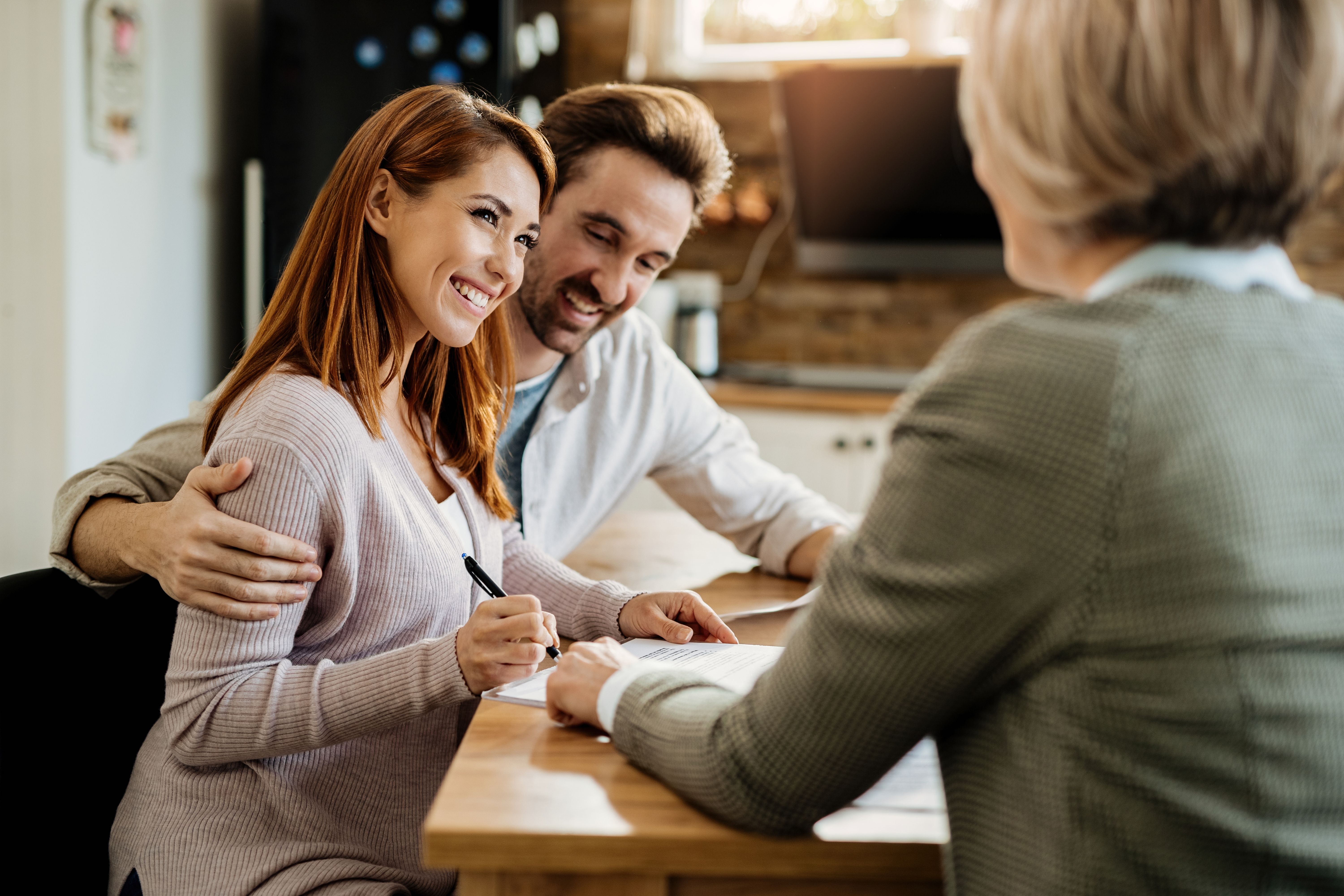 A diverse group of people meeting with a mortgage broker