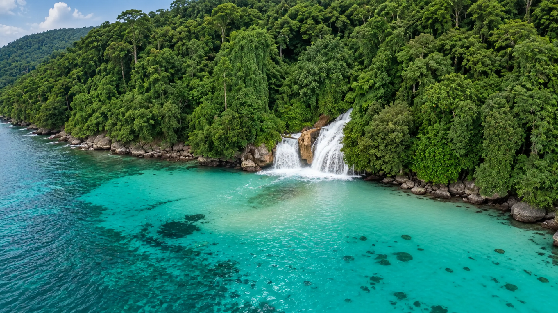 Tiki-Tiki Waterfall at Momon dropping from jungle straight into the sea
