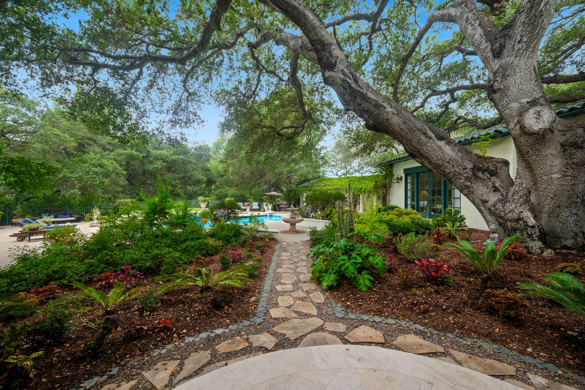 Grounds, pool, sport court, and gardens at 519 Meadow Grove