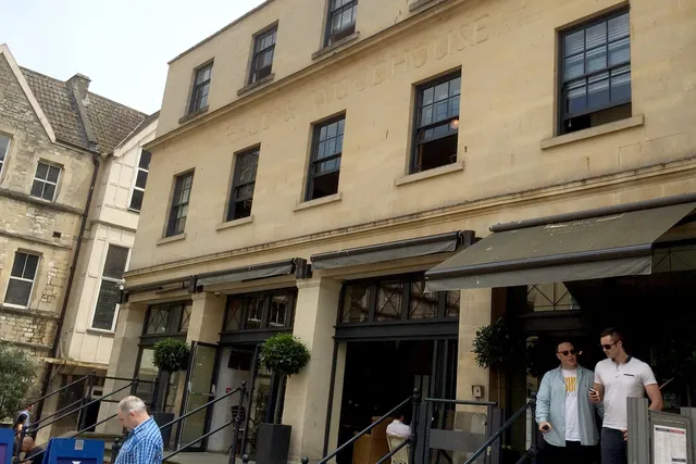 Hall and Woodhouse in Bath: Front entrance of a popular pub, known for its great food, drinks, and charming ambiance