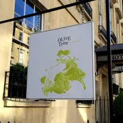 Olive Tree in Bath: Captivating hanging sign, signaling a renowned restaurant known for its exquisite cuisine and inviting dining experience