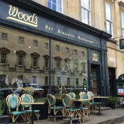 Woods in Bath: Striking front view of a contemporary restaurant, showcasing its modern design and inviting ambiance