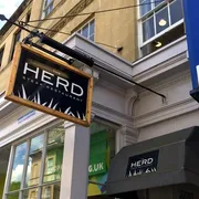 The Herd in Bath: View of the hanging sign, signaling a renowned steakhouse known for its quality cuts and inviting dining experience