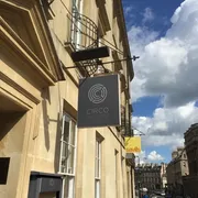 Circo in Bath: Striking entrance signage hanging above, signaling a lively bar experience with a vibrant atmosphere and exciting entertainment