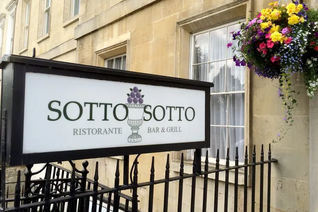 Sotto Sotto in Bath: Eye-catching front signage, beckoning guests to experience the exquisite flavours and cozy ambiance of this Italian restaurant