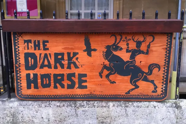 The Dark Horse in Bath: Eye-catching front signage, inviting guests to experience the cozy and inviting ambiance of this beloved bar
