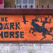 The Dark Horse in Bath: Eye-catching front signage, inviting guests to experience the cozy and inviting ambiance of this beloved bar