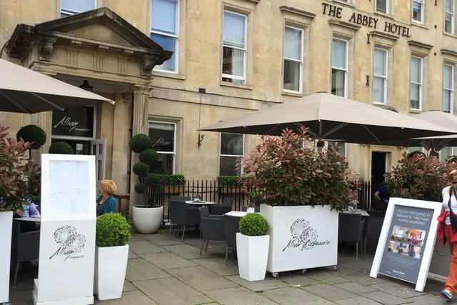Allium in Bath: The front view to Allium and The Abbey Hotel with an outdoor seating area with tables