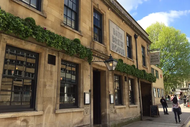 Bath Brew House in Bath: Front view of a lively pub with outdoor seating at the back, offering a vibrant atmosphere and craft beer