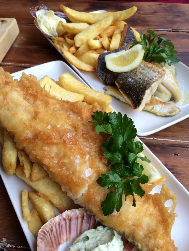 Battered and pan-fried fish with chips at Scallop Shell in Bath