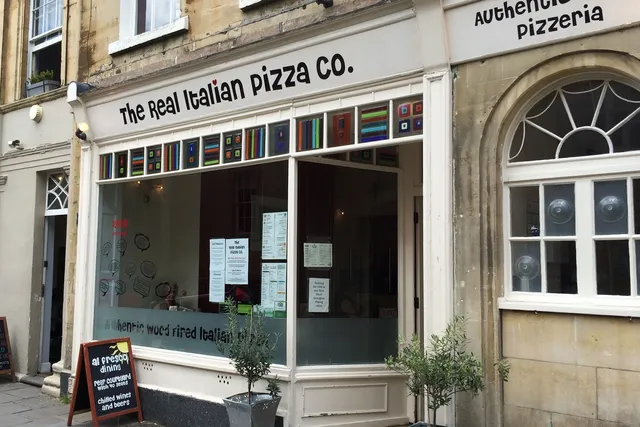 Real Italian Pizza Company in Bath: Front view of a bustling pizzeria, showcasing its authentic Italian charm and mouthwatering pizza creations