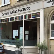 Real Italian Pizza Company in Bath: Front view of a bustling pizzeria, showcasing its authentic Italian charm and mouthwatering pizza creations