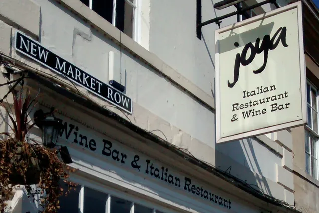Joya in Bath: Hanging signage, inviting visitors to experience the delightful flavours and its warm ambiance
