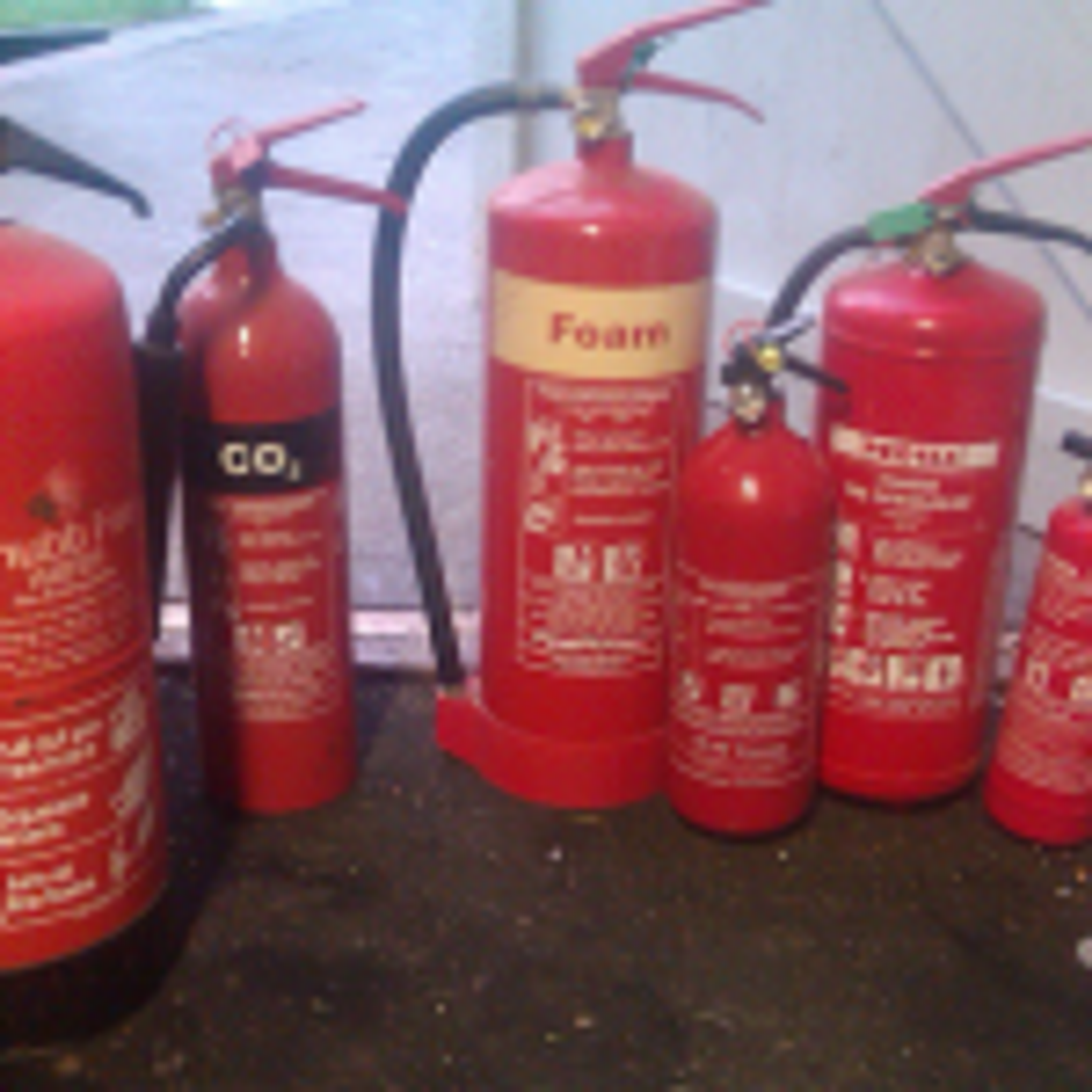 A lot of fire extinguishers