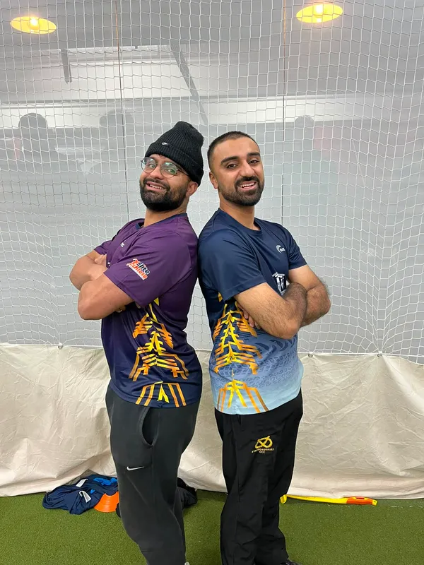Two Cricademia coaches at the indoor nets