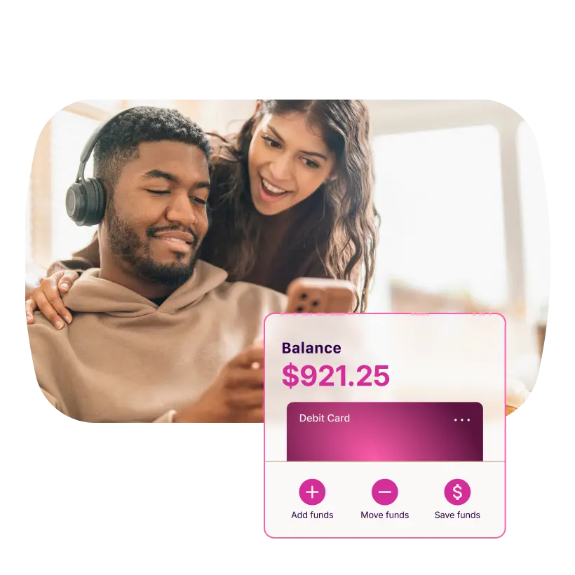 A couple views a mobile banking app with a $921.25 balance, a debit card, and options for managing funds.