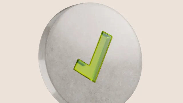 Translucent green checkmark on a textured grey disc.