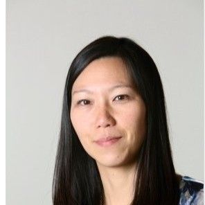Headshot of an East Asian woman with long dark hair and a slight smile.