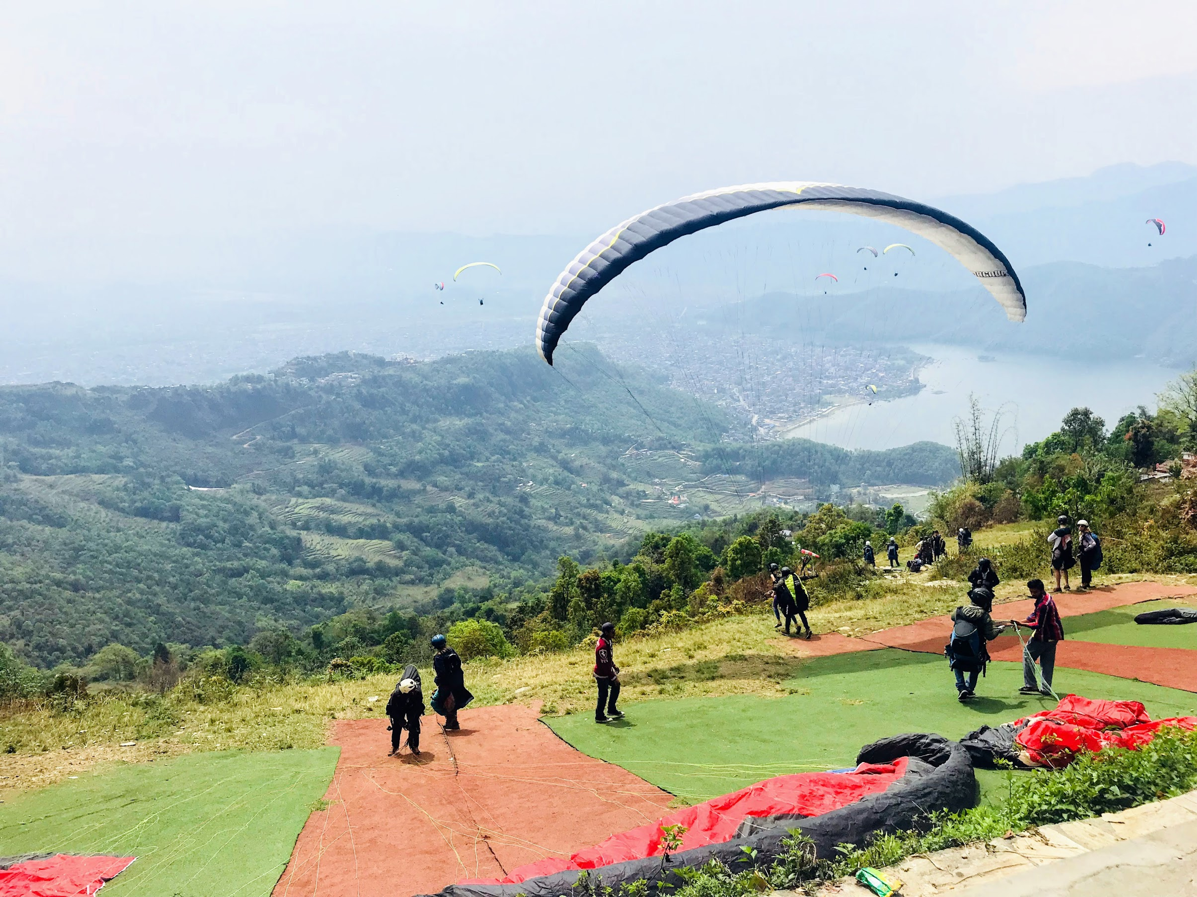 Paragliders getting ready on the Toripani take-off
