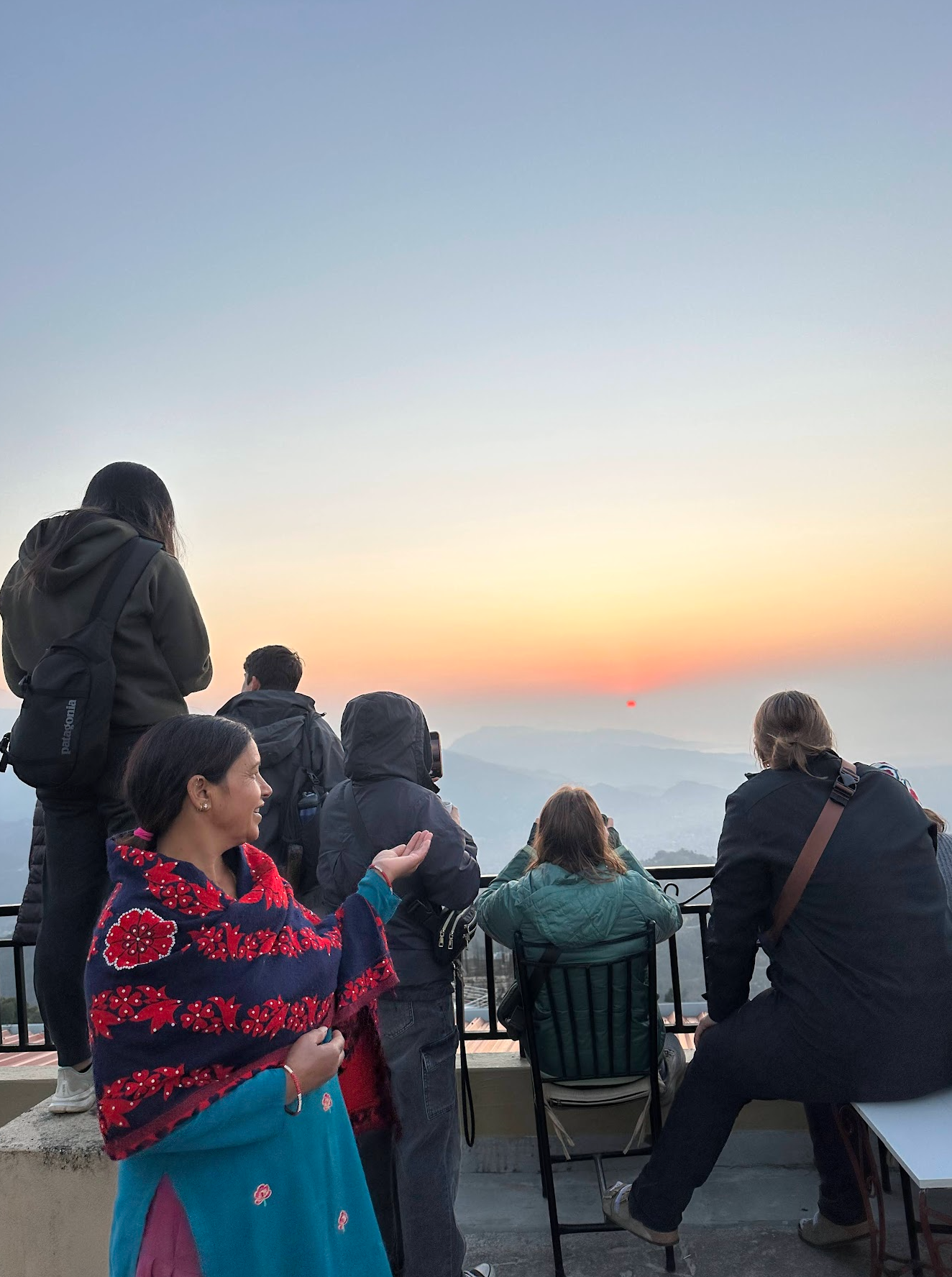 Maya and guests watching the sunrise on the terrace