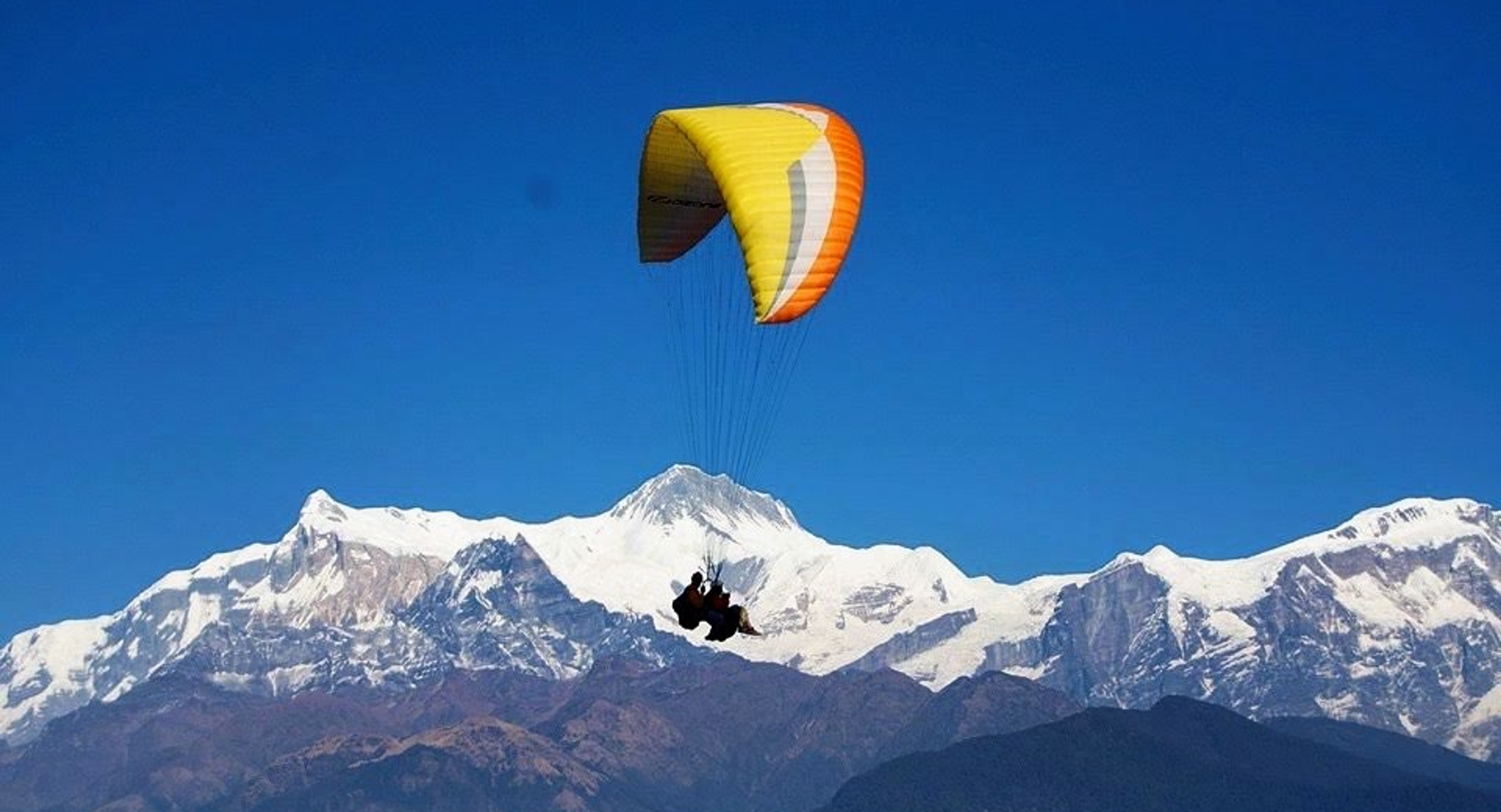 Tandem paragliding. Annapurna in the background.