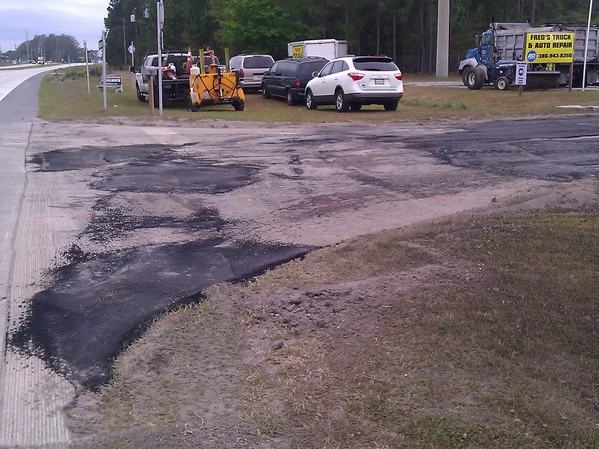 Parking lot repavement before photo: the original parking lot surface before it was repaved