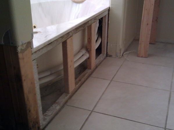 Bathroom tub replacement before photo: the original tub as it appeared before the replacement