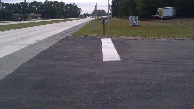 Parking lot repavement after photo: the repaved parking lot finished and ready for use, view 1 of 2