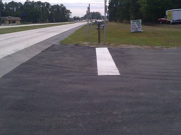 Parking lot repavement after photo: the repaved parking lot finished and ready for use, view 1 of 2