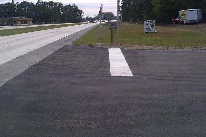 Parking lot repavement after photo: the repaved parking lot finished and ready for use, view 1 of 2